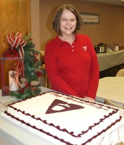 Christyne Calvin poses during her retirement party last week. She will retire this month after 34 years with the bank.