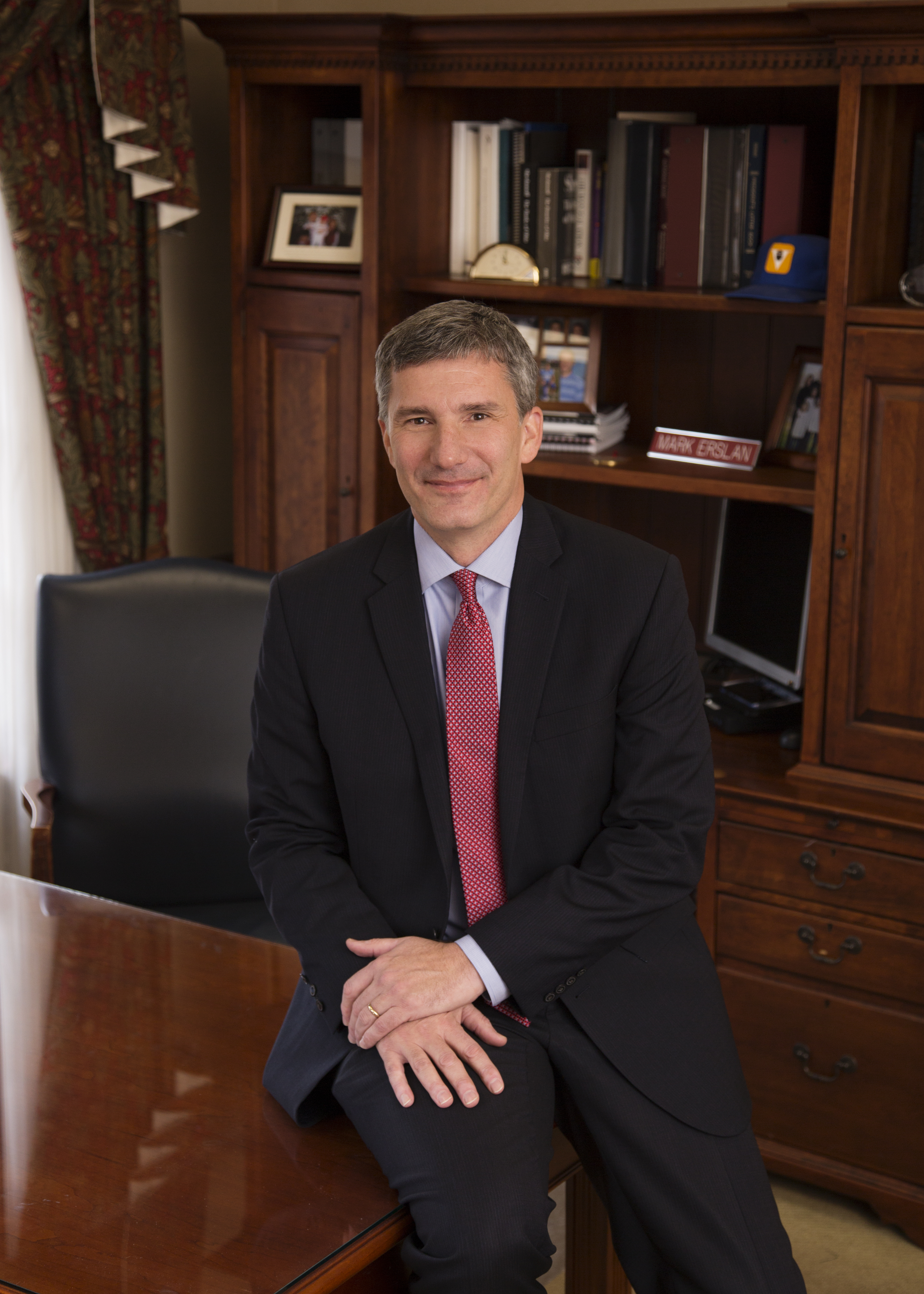 Mark sitting on desk